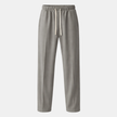 Men's wide-leg drawstring joggers by FJØRNA, relaxed casual sweatpants with elastic waistband and loose fit, shown in black.