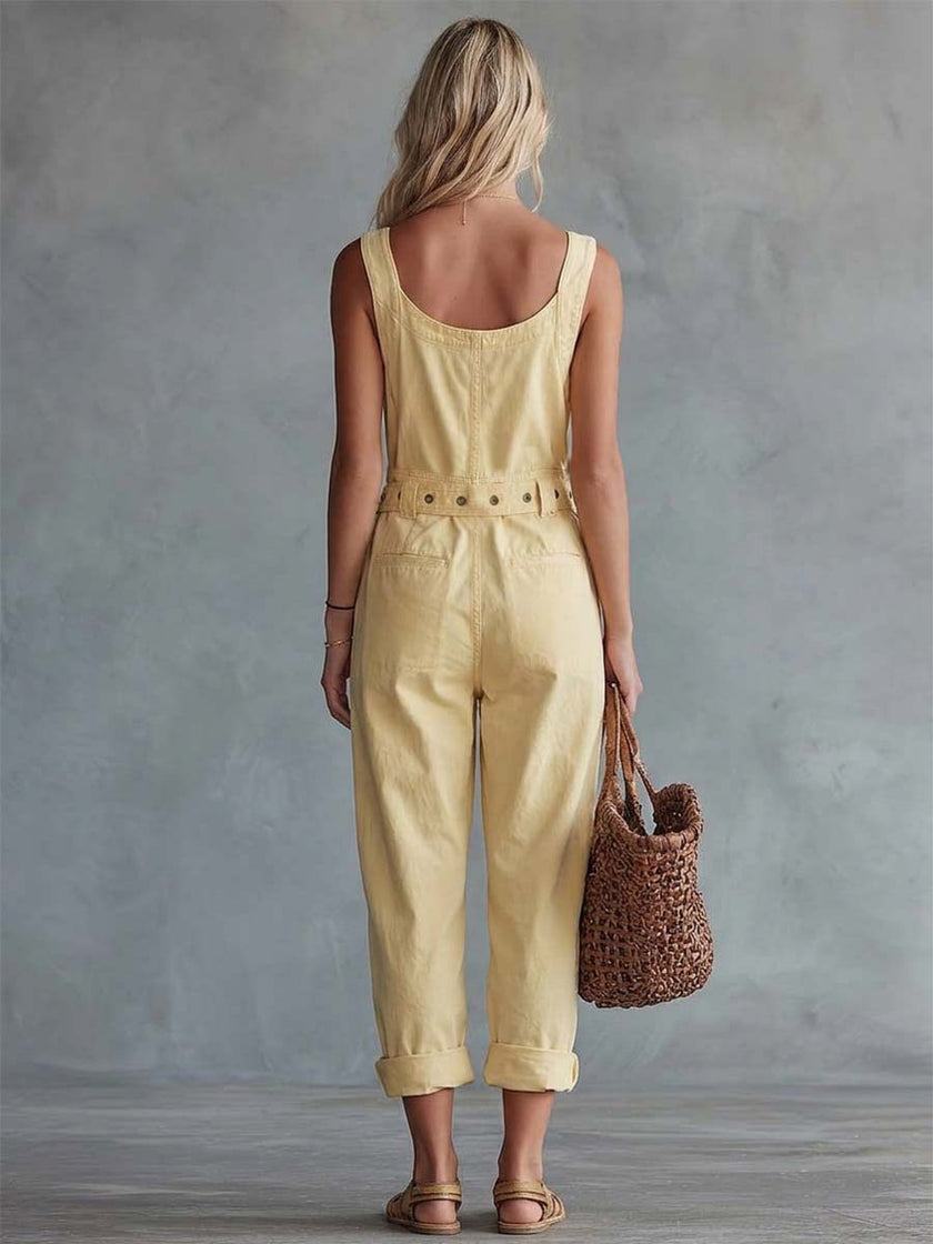 Light yellow denim jumpsuit with square neckline and zip-front, designed for women by FJØRNA, shown on a model.