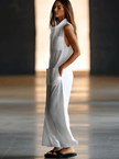 White linen sleeveless wide-leg jumpsuit for women, stylish FJØRNA pants with a relaxed fit, perfect for warm weather.