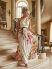 FJØRNA women's floral summer maxi dress with halter neck and sleeveless design, flowing lightweight fabric for warm weather.