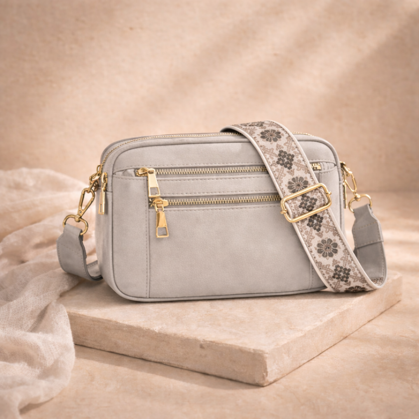 Black FJØRNA leather shoulder bag for women, stylish refined leather bag with shoulder strap and sleek design.
