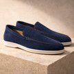 FJØRNA navy suede slip-on loafers for men, showcasing a sleek smart casual shoe with a smooth suede finish.
