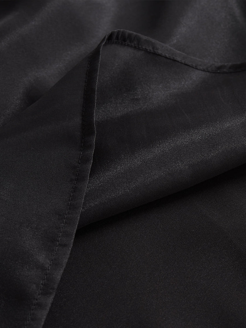 Black chiffon high-neck sleeveless blouse for women by FJØRNA, featuring a stylish high neckline and elegant sleeveless design.