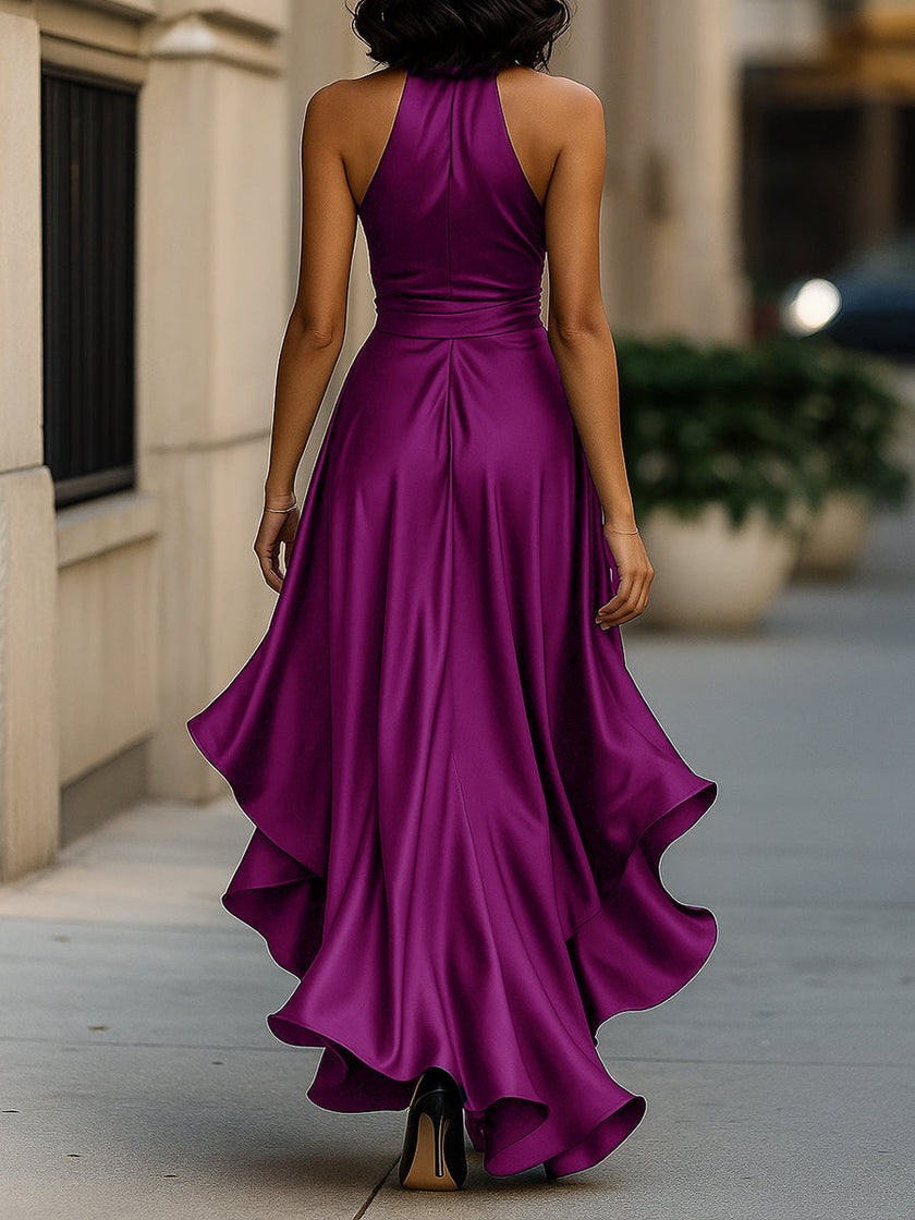 Navy satin halter ruffle gown by FJØRNA featuring elegant design and flowing fabric, suitable for formal black tie events.