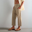 FJØRNA women's wide-leg denim trousers displayed on a model, showcasing the relaxed fit and stylish design.