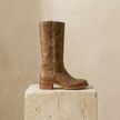 Tan knee-high block heel leather boots for women by FJØRNA, featuring winter-ready design and sturdy heel for stylish warmth.