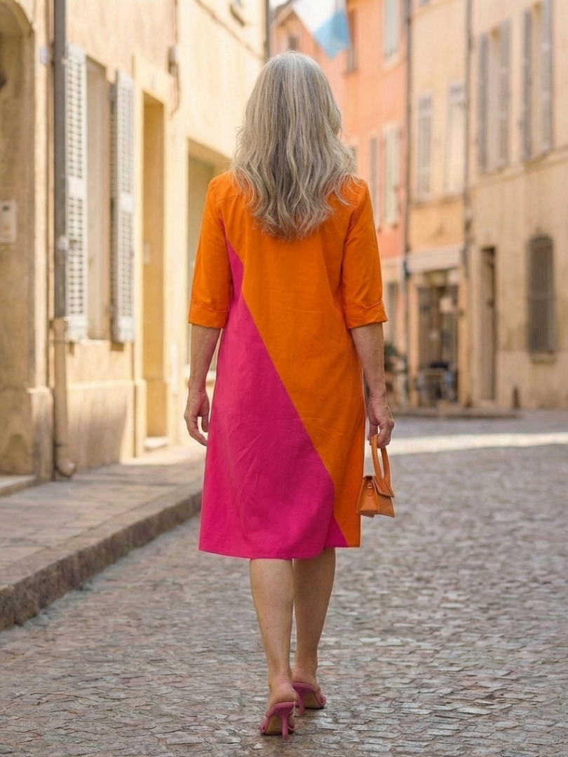 Flowy women's summer wrap dress by FJØRNA featuring lightweight fabric and a flattering fit, perfect for warm weather.