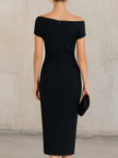 FJØRNA black asymmetric one-shoulder midi dress, stylish cocktail dress with a unique neckline and elegant fit, perfect for formal occasions.