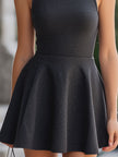FJØRNA charcoal sleeveless turtleneck flared mini dress, close-up of stylish dress with fitted bodice and flared skirt.
