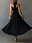 FJØRNA black halter neck midi dress, elegant evening dress with fitted bodice and flowing skirt, perfect for formal occasions.