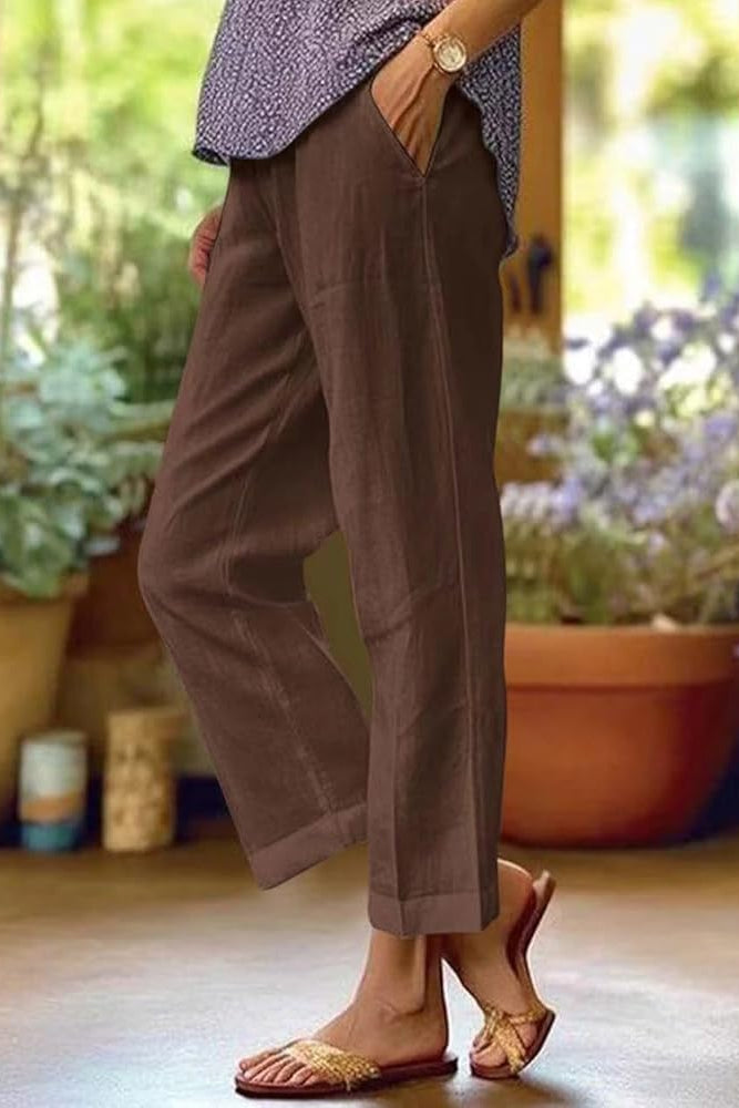 FJØRNA women's lightweight summer trousers with straight leg fit and front pockets, ideal for casual warm-weather wear.