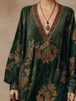Green faux suede tassel maxi dress for women by FJØRNA, featuring a flowing silhouette and tassel details.