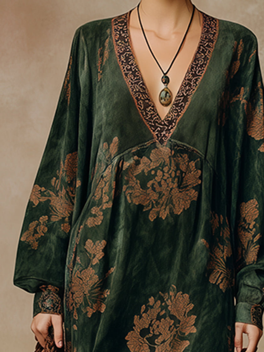 Green faux suede tassel maxi dress for women by FJØRNA, featuring a flowing silhouette and tassel details.