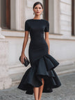 FJØRNA black asymmetric ruffle-hem midi dress featuring a stylish ruffle hem and elegant design, perfect for fashionable occasions.