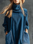 Blue corduroy midi dress by FJØRNA, casual style with long sleeves and fitted waist, displayed on a hanger.