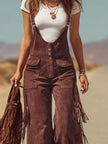 Brown micro suede tassel wide-leg women's dungarees by FJØRNA, showing the stylish, relaxed fit and tassel details.