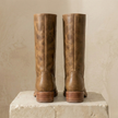 Tan knee-high block heel boots for women by FJØRNA, featuring winter leather design and stylish footwear for cold weather.