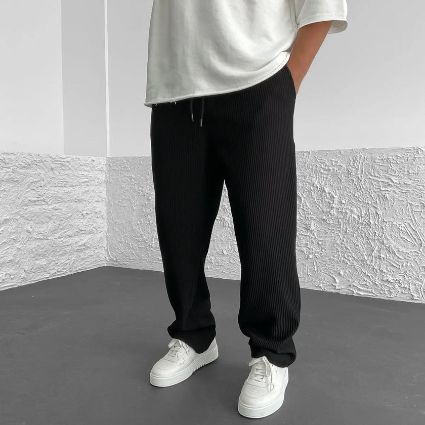 Men's relaxed knit trousers in khaki by FJØRNA, showing soft fabric and casual fit perfect for comfortable everyday wear.