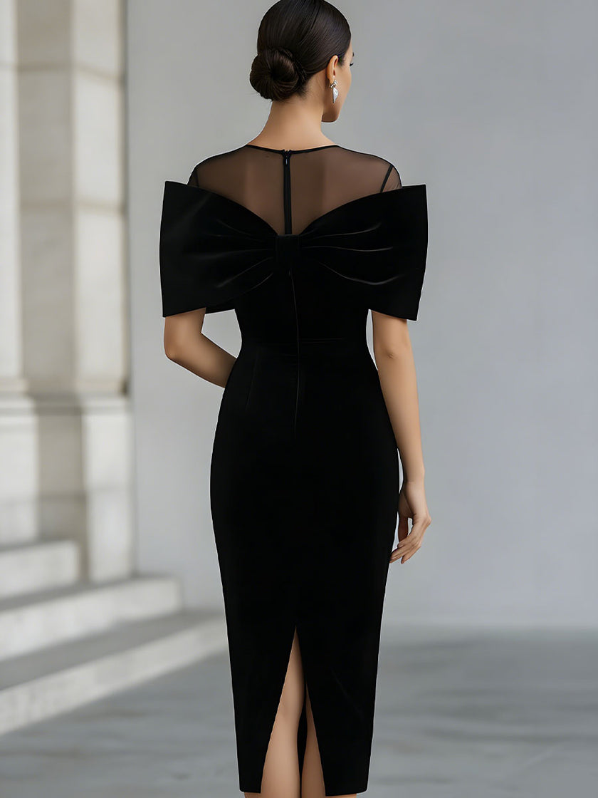 FJØRNA black velvet bow midi dress with fitted waist and elegant design, perfect for formal occasions.