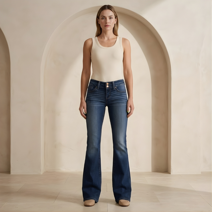 Women's mid-waist slim-fit flared stretch jeans by FJØRNA, showing the stylish flared leg and classic denim appearance.