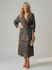 FJØRNA women's summer midi dress with long sleeves and wrap design, stylish and comfortable for warm weather wear.