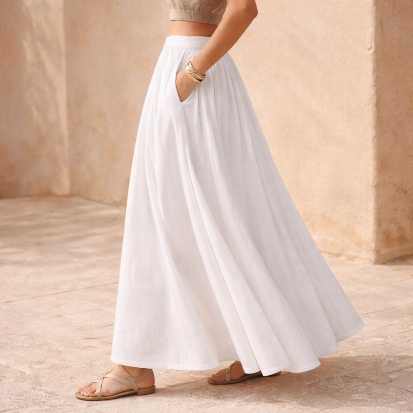 FJØRNA high-waist white A-line maxi skirt for women, flowing fabric, full-length design, elegant and versatile for various outfits.