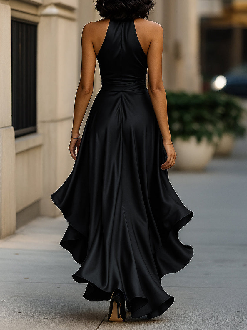 FJØRNA navy satin halter gown with ruffle details, elegant black tie dress for formal events.
