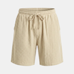 FJØRNA men's textured drawstring relaxed-fit casual summer shorts, showing the lightweight fabric and adjustable waistband.