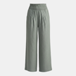White high waist wide leg trousers for women by FJØRNA, showing the relaxed fit and flowing fabric of the stylish pants.