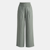 White high waist wide leg trousers for women by FJØRNA, showing the relaxed fit and flowing fabric of the stylish pants.