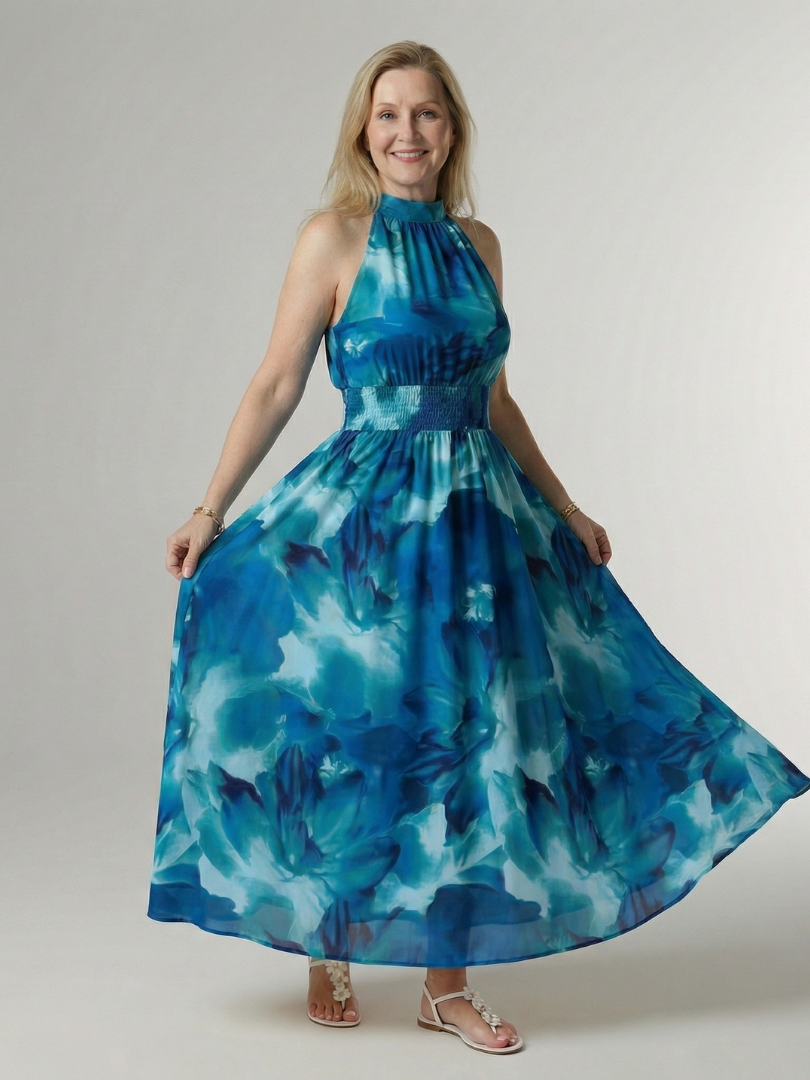 FJØRNA women's summer midi dress with halter neck and sleeveless, flowy design perfect for warm weather.