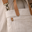 Large canvas messenger bag for women by FJØRNA, featuring a stylish shoulder bag design with adjustable strap and spacious interior.