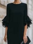 FJØRNA black ruffled sheer sleeve midi dress with elegant cocktail style, featuring flowy fabric and stylish ruffle details.