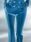 Blue loose velvet flared pants for women by FJØRNA, featuring a relaxed fit and stylish flare design.