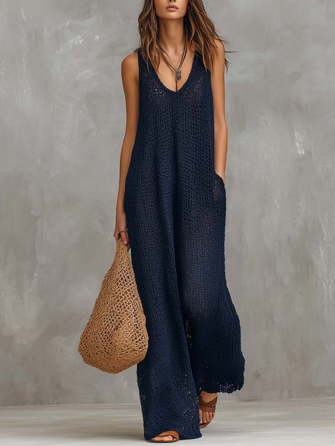 Navy boho knitted sleeveless jumpsuit for women by FJØRNA, featuring a relaxed fit and stylish design.