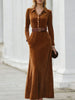 Black velvet maxi dress with chestnut-colored shirt collar by FJØRNA, featuring a flowing design for elegant women's fashion.