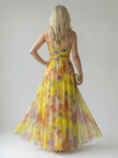 FJØRNA women's sleeveless summer maxi dress with a flowy silhouette and floral pattern, perfect for warm weather.