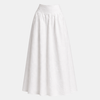 White cotton high-waist maxi skirt by FJØRNA, flowing long skirt with a smooth waistband, styled as women's pants.
