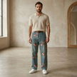Unisex rose print wide-leg floral denim jeans by FJØRNA, showing the colorful, flowy design and relaxed fit of the pants.