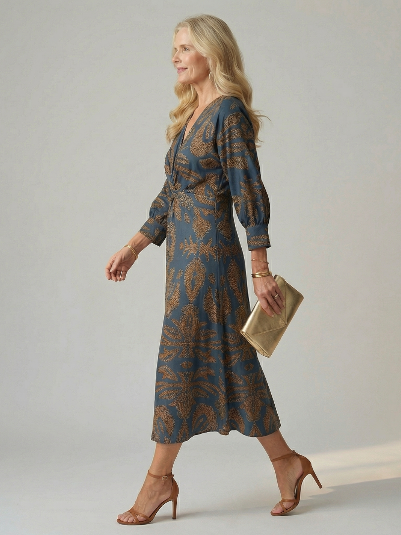 FJØRNA women's summer midi dress with long sleeves and wrap design, featuring a stylish and flowy silhouette.