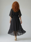 FJØRNA women's summer midi dress with a V-neck, flowy fabric, and short sleeves, perfect for warm-weather styling.