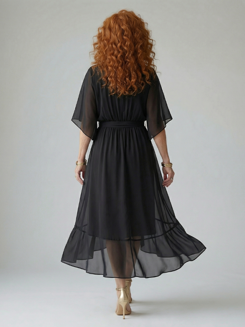 FJØRNA women's summer midi dress with a V-neck, flowy fabric, and short sleeves, perfect for warm-weather styling.
