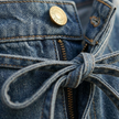 FJØRNA women's denim wide-leg jumpsuit with tie-back design, featuring a fashionable and comfortable women’s set style.