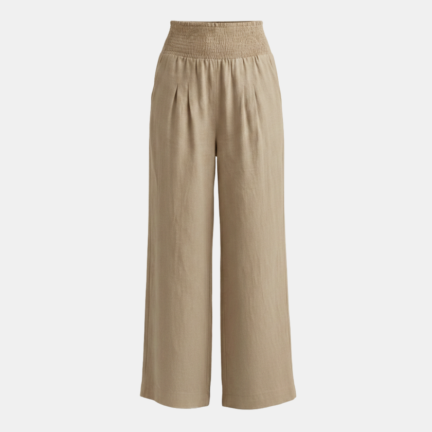 White high waist wide leg trousers for women by FJØRNA, showcasing relaxed fit and stylish wide-leg design.
