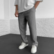 Men's relaxed-fit knit trousers in khaki by FJØRNA, shown with a comfortable, casual fit and soft knit fabric.