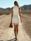 FJØRNA denim tassel mini dress for women showcasing a stylish sleeveless dress with tassel details and a fitted silhouette.