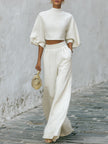 Cream textured lantern sleeve two-piece set for women featuring stylish pants from FJØRNA, shown on a model.