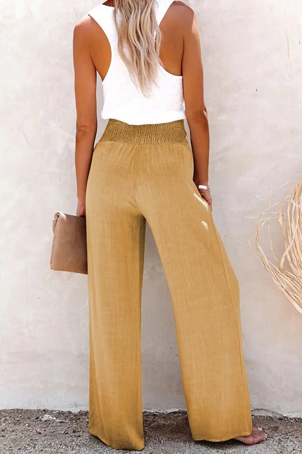 FJØRNA lightweight summer trousers for women with high waist and smocked design, shown in a relaxed fit.