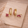 Unisex FJØRNA minimalist piercing set with stainless steel hoops and studs, featuring simple, modern jewelry accessories for women.