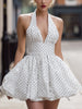 FJØRNA vintage white halter polka dot bubble mini dress for women, sleeveless with a retro-inspired fit and playful polka dot pattern.